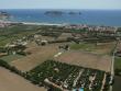 Vista aèria de la plana de Torrella, amb un càmping en primer terme i les Medes, al fons Foto:EPA